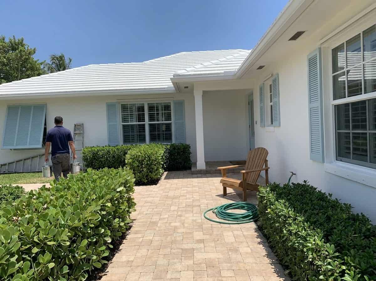 Exterior painting prep at a coastal style home in Lantana, FL