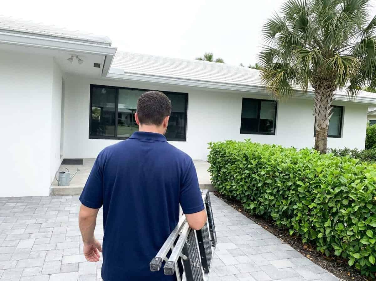 Handyman arriving at a updated single-story home in Palm Springs, FL