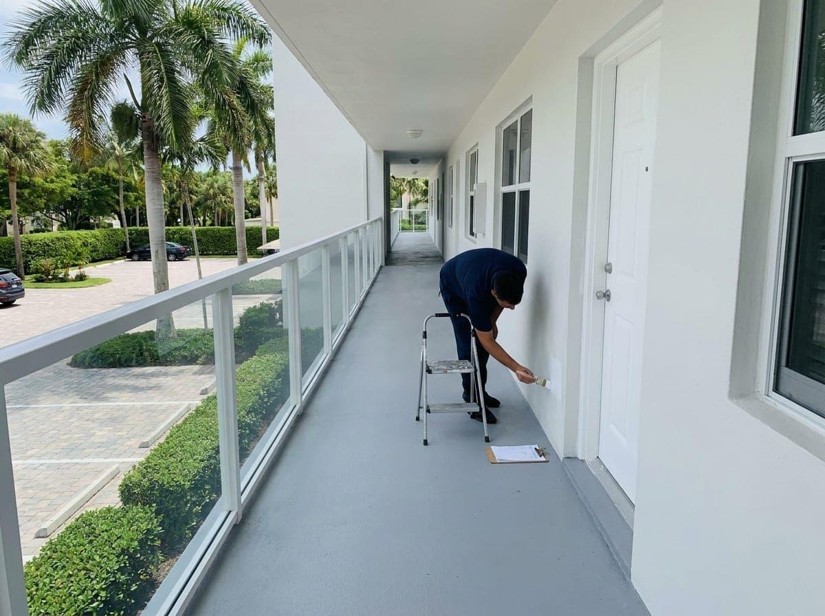 Walkway touch up painting at a condo building in Palm Beach County, FL