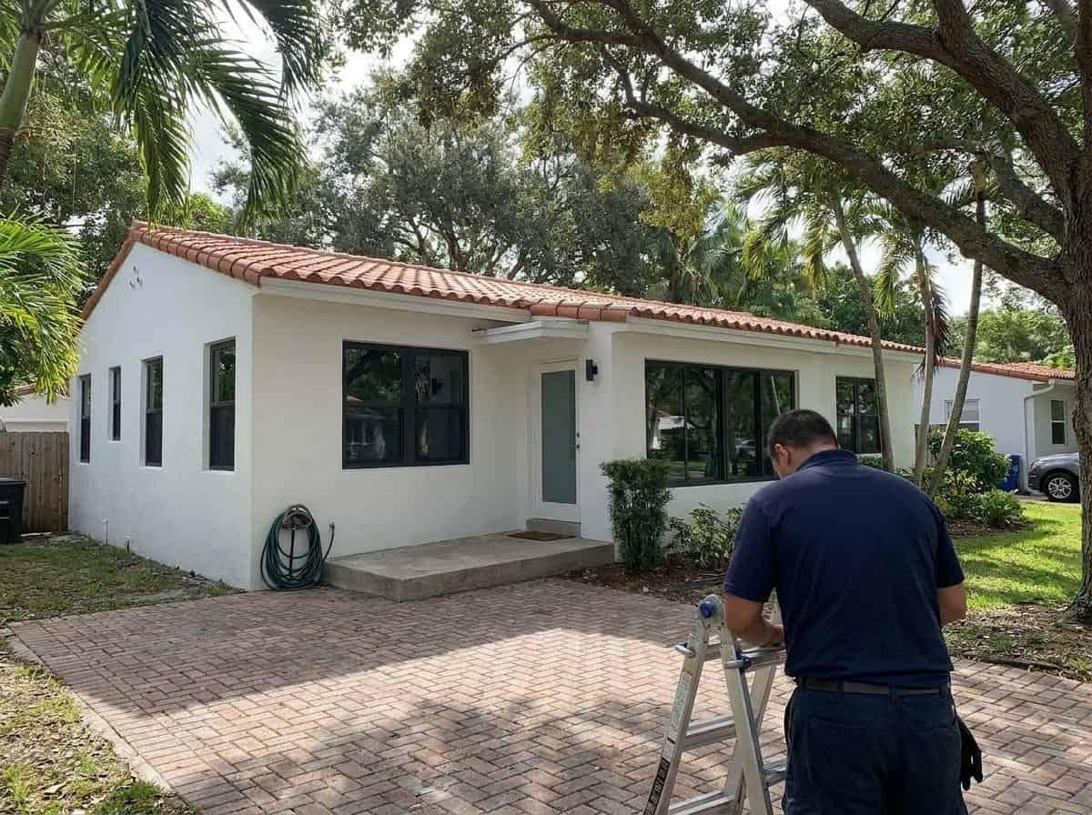 Well-kept shaded house on a tree-canopied street in Glen Ridge, FL