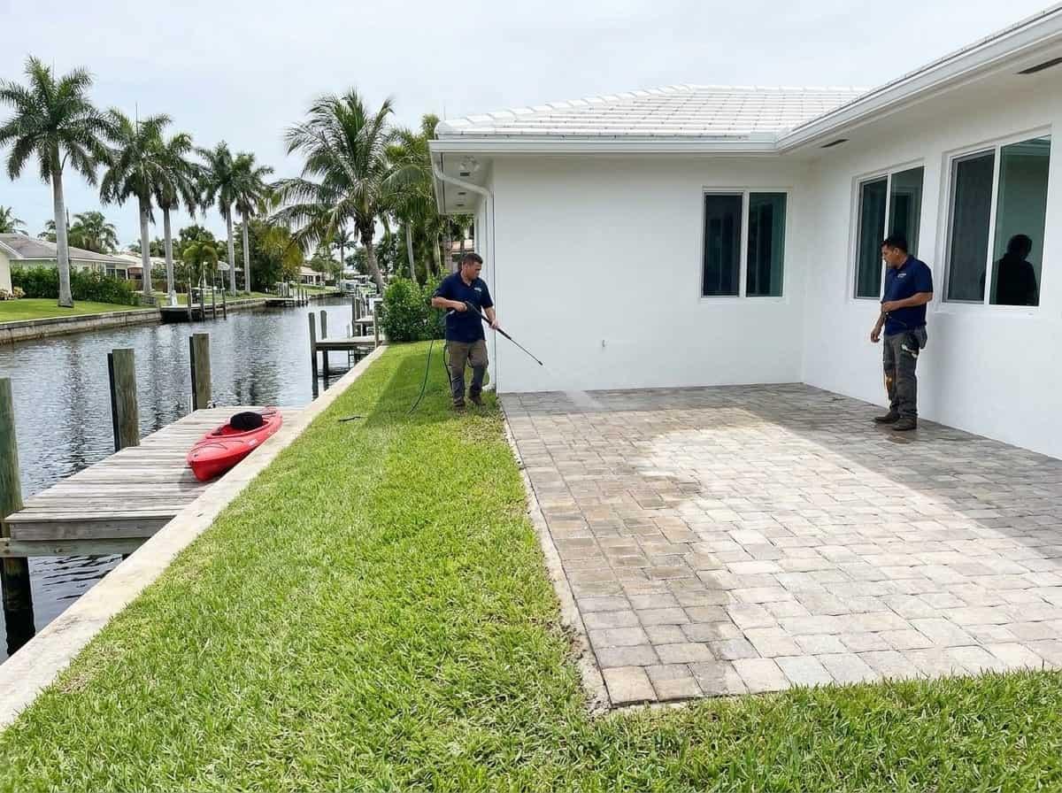 Pressure washing a canal-side home in Lake Clarke Shores, FL
