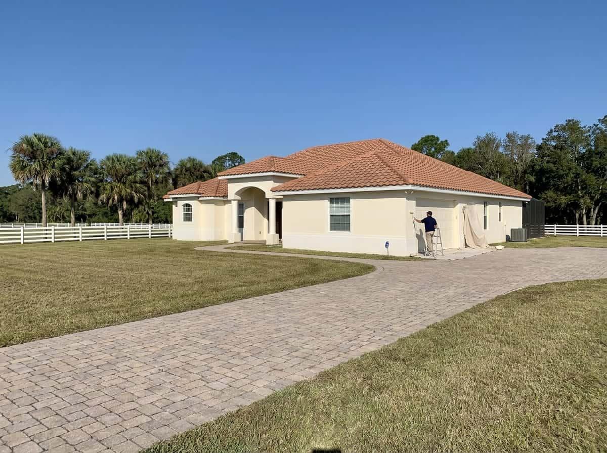 Painting a garage wall at an estate home in The Acreage, FL