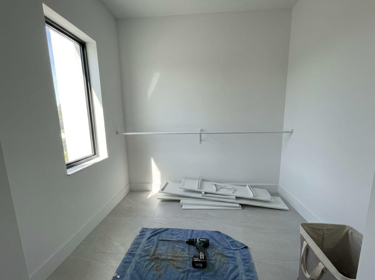 Closet shelving being installed in a bedroom in Palm Beach County, FL